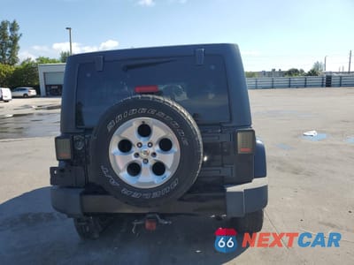 Zdjęcie 6 z 12 samochodu: 2013 JEEP WRANGLER UNLIMITED SAHARA VIN:1C4BJWEG2DL635174 - miniatura