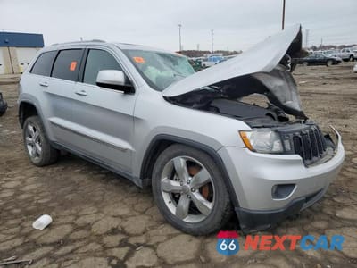 Czwarte zdjęcie samochodu z boku: 2012 JEEP GRAND CHEROKEE LAREDO VIN:1C4RJFAG1CC219054 - miniatura