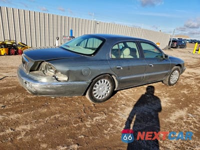 Trzecie zdjęcie samochodu z tyłu: 2000 LINCOLN CONTINENTAL VIN:1LNHM97V8YY892407 - miniatura