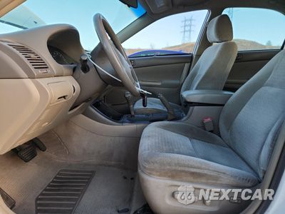 Zdjęcie 7 z 14 samochodu: 2004 TOYOTA CAMRY LE VIN:4T1BF32K44U073065 - miniatura