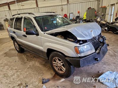 Czwarte zdjęcie samochodu z boku: 2003 JEEP GRAND CHEROKEE LAREDO VIN:1J4GW48S23C560531 - miniatura