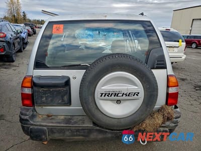 Zdjęcie 6 z 11 samochodu: 2000 CHEVROLET TRACKER VIN:2CNBJ13C6Y6910753 - miniatura
