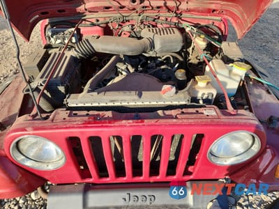 Zdjęcie 12 z 14 samochodu: 1999 JEEP WRANGLER / TJ SE VIN:1J4FY29P9XP467458 - miniatura