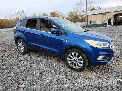 Czwarte zdjęcie samochodu z boku: 2017 FORD ESCAPE TITANIUM VIN:1FMCU9JD0HUA12611 - miniatura