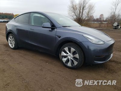 Czwarte zdjęcie samochodu z boku: 2023 TESLA MODEL Y VIN:7SAYGAEE3PF690592 - miniatura