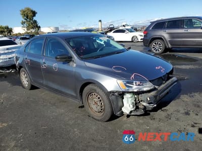 Czwarte zdjęcie samochodu z boku: 2016 VOLKSWAGEN JETTA S VIN:3VW267AJ5GM343835 - miniatura