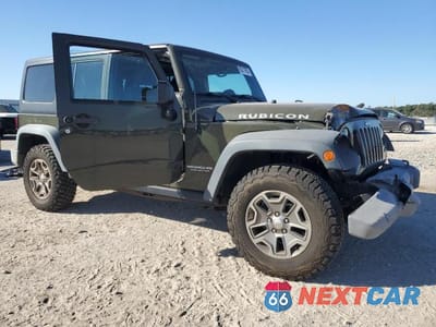 Czwarte zdjęcie samochodu z boku: 2015 JEEP WRANGLER UNLIMITED RUBICON VIN:1C4BJWFG8FL638789 - miniatura