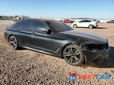 Czwarte zdjęcie samochodu z boku: 2020 BMW M550XI VIN:WBAJS7C06LCD81410 - miniatura