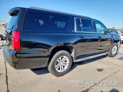 Trzecie zdjęcie samochodu z tyłu: 2019 CHEVROLET SUBURBAN C1500 LT VIN:1GNSCHKC5KR400101 - miniatura