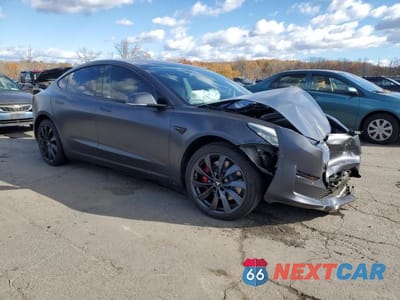 Czwarte zdjęcie samochodu z boku: 2018 TESLA MODEL 3 VIN:5YJ3E1EB1JF083049 - miniatura