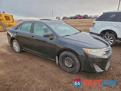 Czwarte zdjęcie samochodu z boku: 2014 TOYOTA CAMRY HYBRID VIN:4T1BD1FK2EU112516 - miniatura