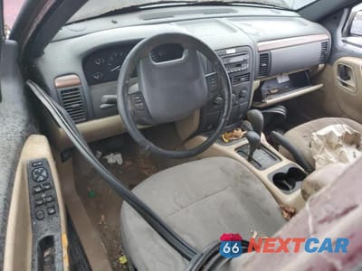 Zdjęcie 8 z 13 samochodu: 1999 JEEP GRAND CHEROKEE LAREDO VIN:1J4GW58SXXC566847 - miniatura