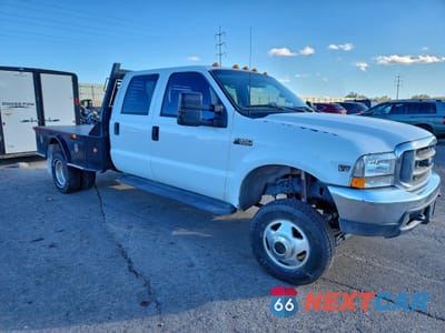 Czwarte zdjęcie samochodu z boku: 1999 FORD F350 SUPER DUTY VIN:1FTWW33FXXEA90068 - miniatura