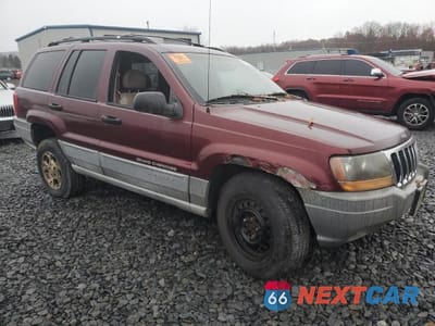 Czwarte zdjęcie samochodu z boku: 1999 JEEP GRAND CHEROKEE LAREDO VIN:1J4GW58SXXC566847 - miniatura