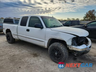 Czwarte zdjęcie samochodu z boku: 2003 GMC NEW SIERRA K1500 VIN:1GTEK19T83E378335 - miniatura