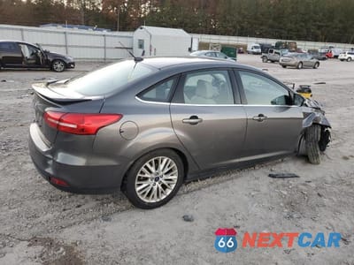 Trzecie zdjęcie samochodu z tyłu: 2018 FORD FOCUS TITANIUM VIN:1FADP3J24JL293941 - miniatura
