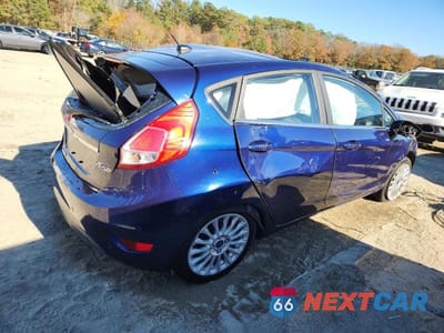Trzecie zdjęcie samochodu z tyłu: 2016 FORD FIESTA TITANIUM VIN:3FADP4FJ4GM201918 - miniatura
