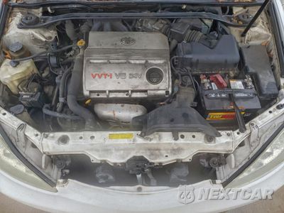 Zdjęcie 11 z 12 samochodu: 2005 TOYOTA CAMRY LE VIN:4T1BF32K05U085604 - miniatura