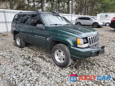 Czwarte zdjęcie samochodu z boku: 1998 JEEP GRAND CHEROKEE LAREDO VIN:1J4GZ48Y7WC276165 - miniatura