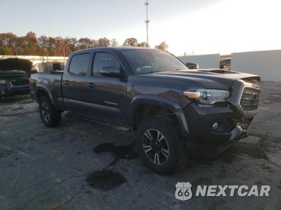 Czwarte zdjęcie samochodu z boku: 2018 TOYOTA TACOMA DOUBLE CAB VIN:3TMDZ5BN2JM050426 - miniatura