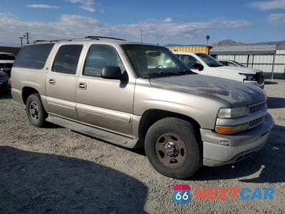 Czwarte zdjęcie samochodu z boku: 2002 CHEVROLET SUBURBAN C1500 VIN:1GNEC16T42J216099 - miniatura
