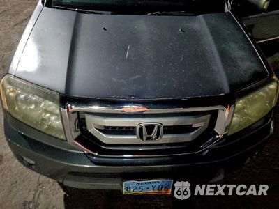 Zdjęcie 11 z 12 samochodu: 2011 HONDA PILOT TOURING VIN:5FNYF4H95BB081903 - miniatura