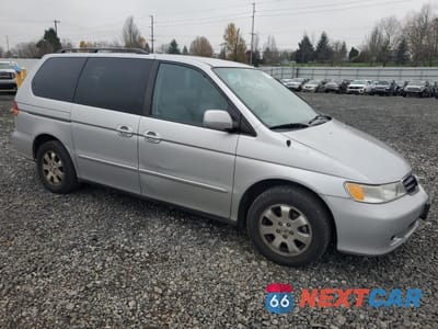 Czwarte zdjęcie samochodu z boku: 2002 HONDA ODYSSEY EXL VIN:2HKRL18042H567083 - miniatura
