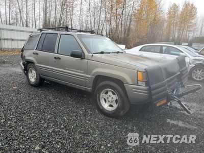 Czwarte zdjęcie samochodu z boku: 1998 JEEP GRAND CHEROKEE LAREDO VIN:1J4GZ48S5WC251986 - miniatura