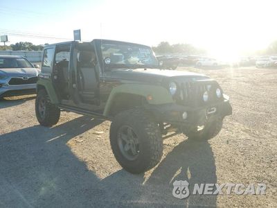 Czwarte zdjęcie samochodu z boku: 2010 JEEP WRANGLER UNLIMITED RUBICON VIN:1J4BA6H11AL228573 - miniatura