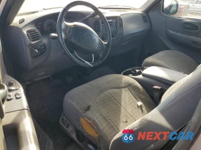 Zdjęcie 8 z 11 samochodu: 2000 FORD F-150 VIN:1FTRX18L2YKA96009 - miniatura