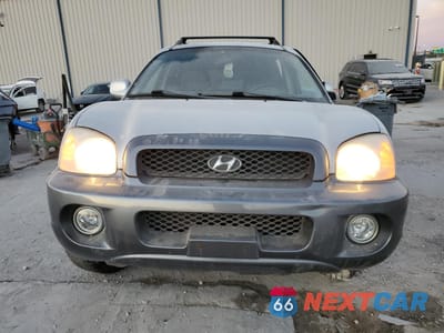 Piąte zdjęcie samochodu w środku: 2003 HYUNDAI SANTA FE GLS VIN:KM8SC13D93U392375 - miniatura