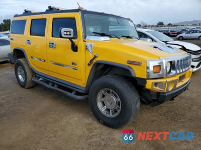 Czwarte zdjęcie samochodu z boku: 2003 HUMMER H2 VIN:5GRGN23U53H142830 - miniatura