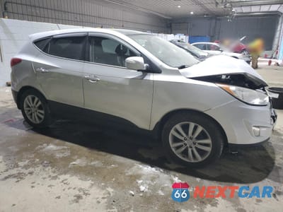 Czwarte zdjęcie samochodu z boku: 2010 HYUNDAI TUCSON GLS VIN:KM8JU3AC7AU102873 - miniatura