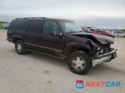 Czwarte zdjęcie samochodu z boku: 1997 CHEVROLET SUBURBAN K1500 VIN:3GNFK16R0VG147011 - miniatura