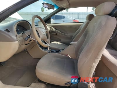 Zdjęcie 7 z 14 samochodu: 1999 FORD MUSTANG VIN:1FAFP4047XF215324 - miniatura