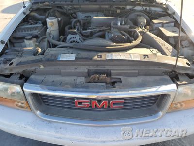 Zdjęcie 12 z 13 samochodu: 1999 GMC JIMMY VIN:1GKCS13W5X2552867 - miniatura