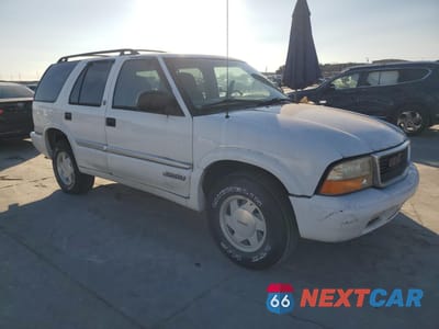Czwarte zdjęcie samochodu z boku: 1999 GMC JIMMY VIN:1GKCS13W5X2552867 - miniatura