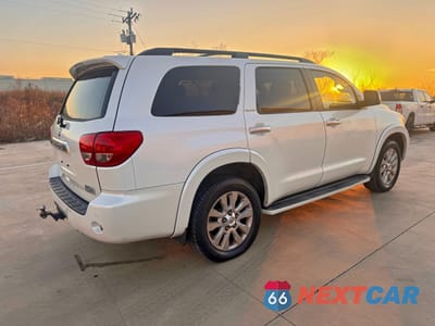 Czwarte zdjęcie samochodu z boku: 2014 TOYOTA SEQUOIA PLATINUM VIN:5TDYY5G14ES055210 - miniatura