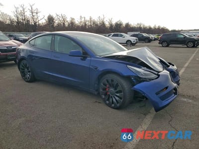 Czwarte zdjęcie samochodu z boku: 2022 TESLA MODEL 3 VIN:5YJ3E1EC3NF295403 - miniatura
