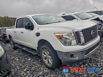 Czwarte zdjęcie samochodu z boku: 2017 NISSAN TITAN XD SL VIN:1N6BA1F29HN517832 - miniatura