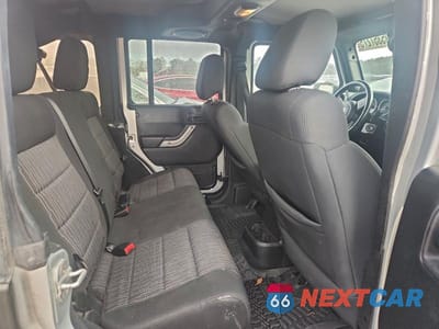 Zdjęcie 11 z 13 samochodu: 2012 JEEP WRANGLER UNLIMITED SAHARA VIN:1C4HJWEG8CL118230 - miniatura