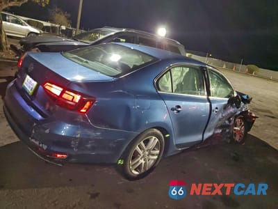 Trzecie zdjęcie samochodu z tyłu: 2017 VOLKSWAGEN JETTA S VIN:3VW2B7AJ1HM380006 - miniatura