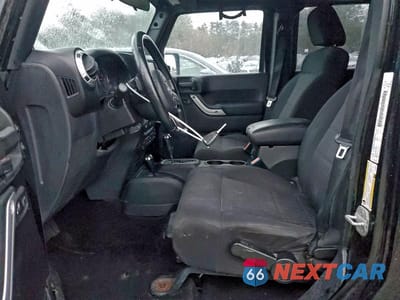 Zdjęcie 7 z 12 samochodu: 2011 JEEP WRANGLER UNLIMITED SAHARA VIN:1J4BA5H13BL603682 - miniatura