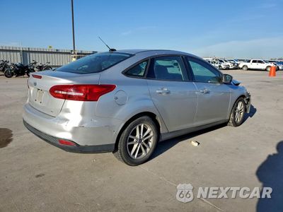 Trzecie zdjęcie samochodu z tyłu: 2018 FORD FOCUS SE VIN:1FADP3F26JL213029 - miniatura