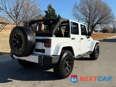 Czwarte zdjęcie samochodu z boku: 2015 JEEP WRANGLER UNLIMITED SAHARA VIN:1C4BJWEG9FL646451 - miniatura