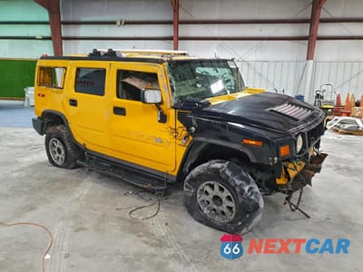 Czwarte zdjęcie samochodu z boku: 2003 HUMMER H2 VIN:5GRGN23UX3H144072 - miniatura