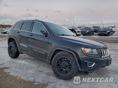 Czwarte zdjęcie samochodu z boku: 2014 JEEP GRAND CHEROKEE LAREDO VIN:1C4RJFAG0EC180850 - miniatura