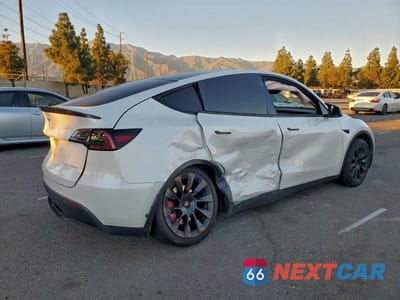Trzecie zdjęcie samochodu z tyłu: 2023 TESLA MODEL Y VIN:7SAYGDEE0PA052489 - miniatura