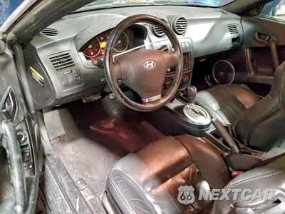 Zdjęcie 8 z 12 samochodu: 2003 HYUNDAI TIBURON GT VIN:KMHHN65F13U029035 - miniatura