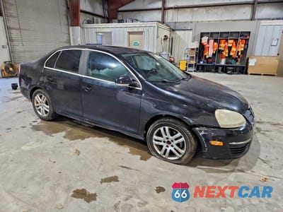 Czwarte zdjęcie samochodu z boku: 2009 VOLKSWAGEN JETTA SE VIN:3VWRZ71K29M162225 - miniatura